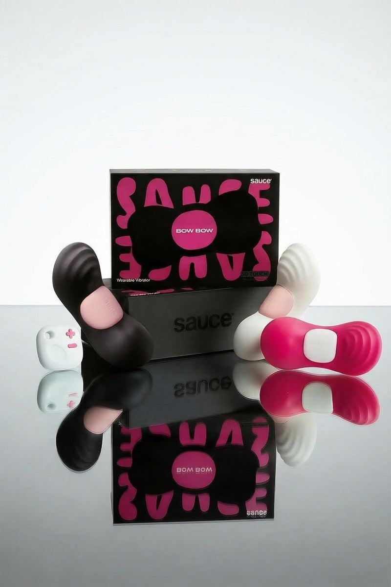 Bow Bow wearable in black, pink and white, with Sauce branding